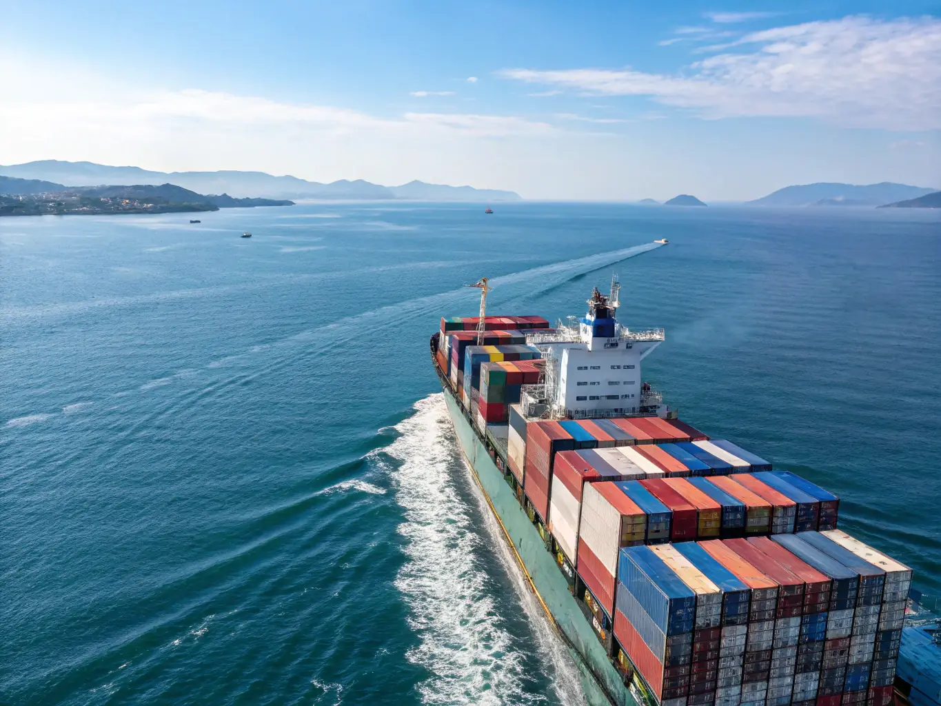 A modern cargo ship is loaded with various vehicles, including cars and trucks, ready for international export. The scene emphasizes the scale and efficiency of global vehicle transportation.